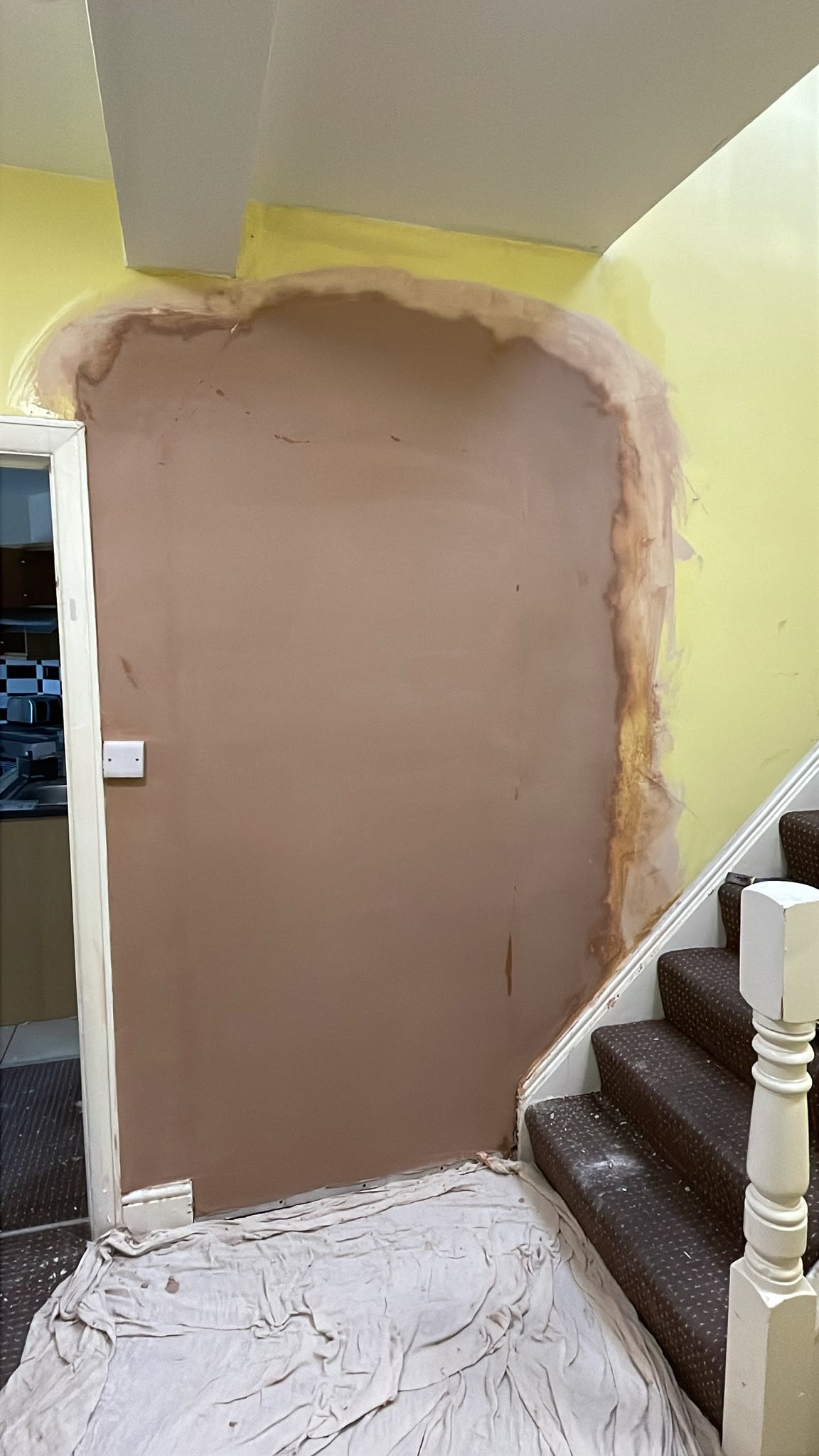 Blocked up opening in stair hall